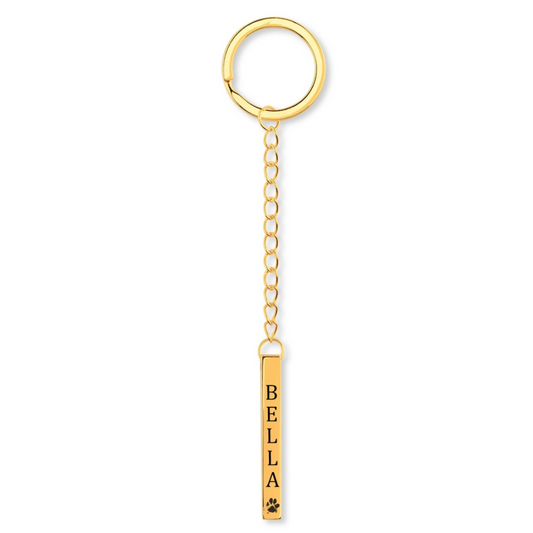 Sleutelhanger hond met naam hond en pootafdruk gegraveerd op bar hanger